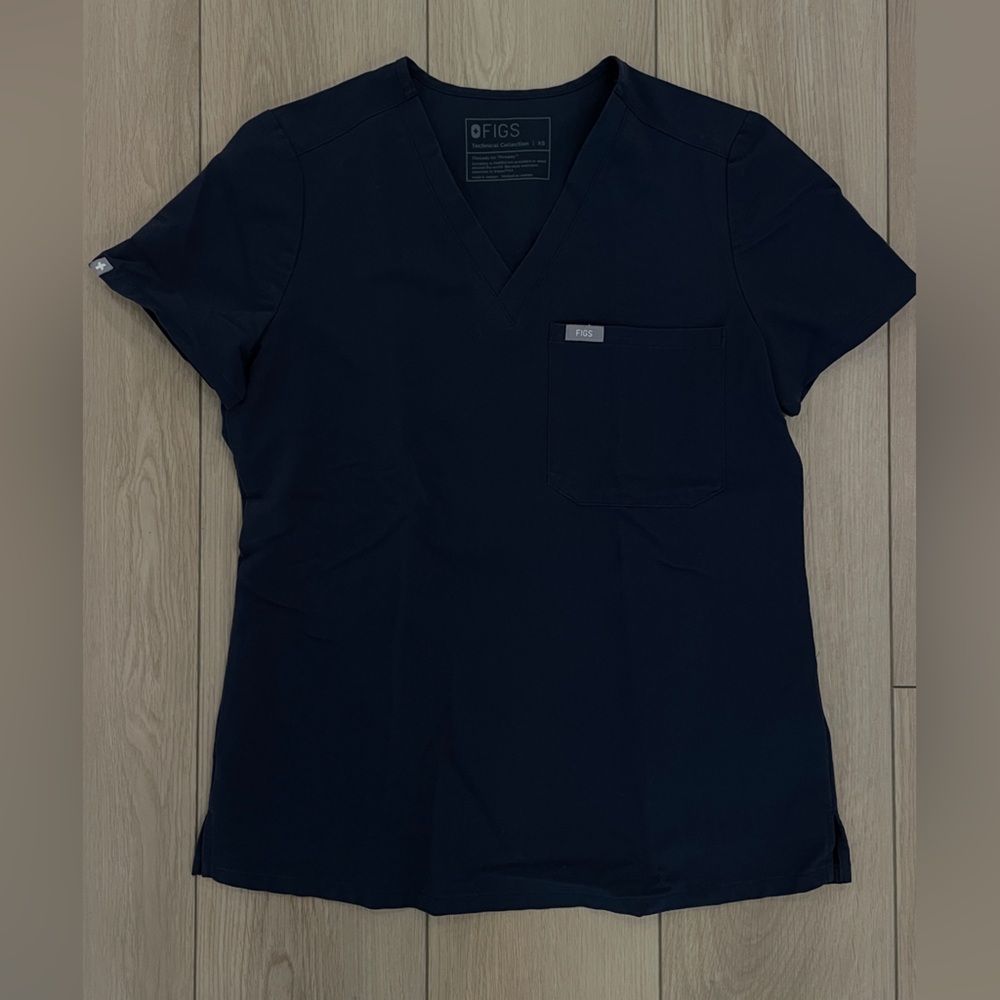 Figs single pocket scrub top. Size XS.